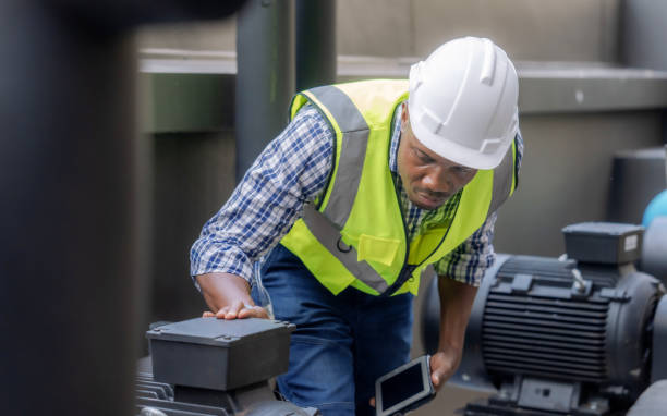 istock Engineer inspects a large industrial centrifugal pump. 1417032056