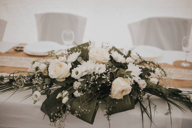 istock Close-up shot of a wedding table decorated with white roses 1417032966