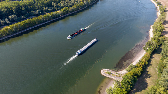 Industrial ships on river with a low water level - aerial view