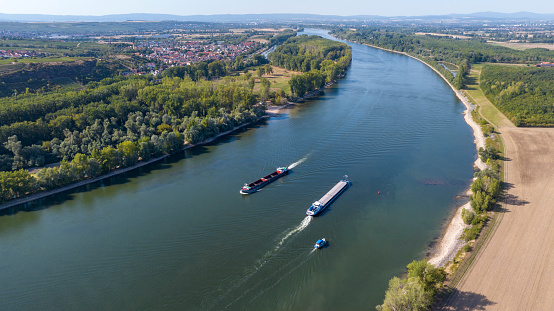 Industrial ships on river with a low water level - aerial view