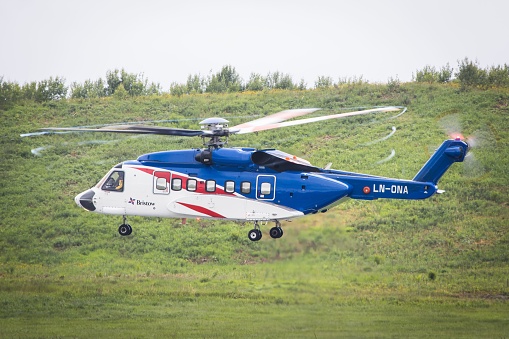 Black military helicopter in flight