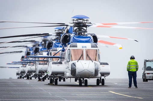 Silhouette of a combat helicopter in the sky, gazelle seen from underneath, air transportation