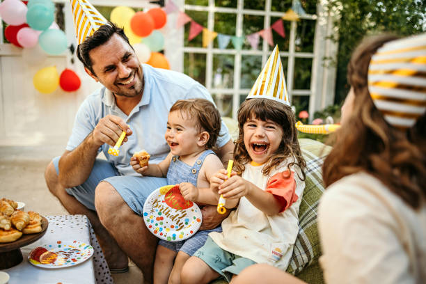 Happy family having fun and celebrating birthday together