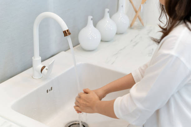 istock Woman washing a hands. 1417037784