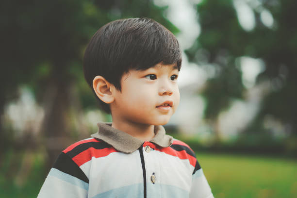 istock Happy young boy playing in the park. 1417038063