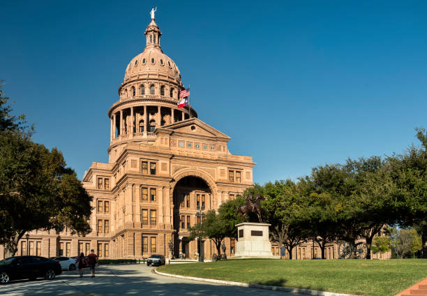 USA Flag and Texas State Flag on Texas State Capitol Dome, Austin, Texas, USA