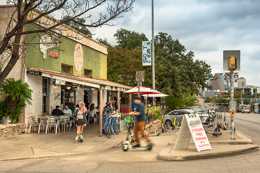 Austin, Texas, USA - November 15, 2021:  People walk along the trendy South Congress Street colourful shops and cool restaurants in Austin Texas USA