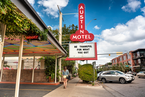 Austin, Texas, USA - November 15, 2021:  Vintage motel and neon sign on trendy South Congress Street in Austin Texas USA