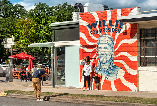 Austin, Texas, USA - November 15, 2021:  People walk along the trendy South Congress Street colourful shops and cool restaurants in Austin Texas USA