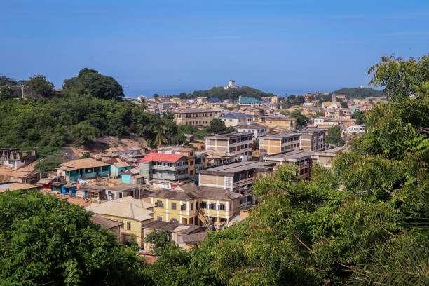 Panoramic View to the Cape Coast Downtown Houses among Green Trees in Ghana stock photo