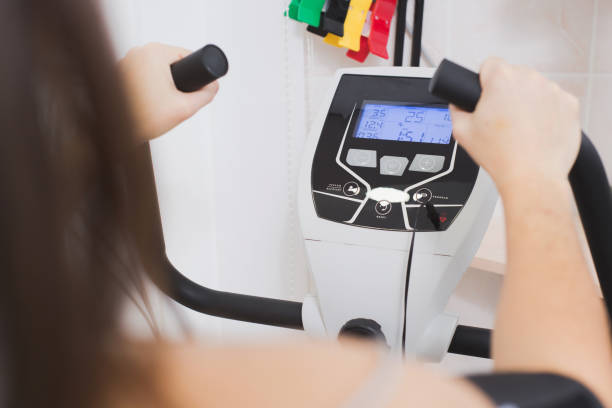 istock Bicycle Ergometry Electrocardiography, bicycle ergometer stress test. Athlete does a cardiac stress test in a medical study, monitored by the doctor 1417044235