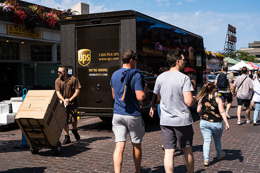 Seattle, USA - Aug 12th 2022: Ups truck at Pike Place Market mid day unloading.