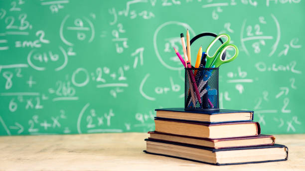 School books and pencils on desk, education concept stock photo