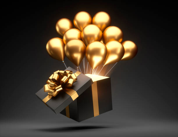 czarne pudełko upominkowe ze złotą wstążką i złotymi balonami - gift card gift certificate gift gold zdjęcia i obrazy z banku zdjęć