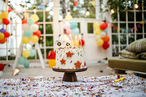 Birthday Cake on a background balloons party decor. Copy space. Trendy Cake. Delicious wedding reception. Celebration baptism concept. Trendy autumn decor.