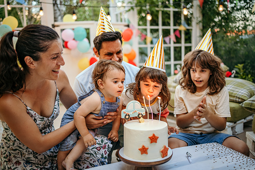 Young family celebrating child’s birthday