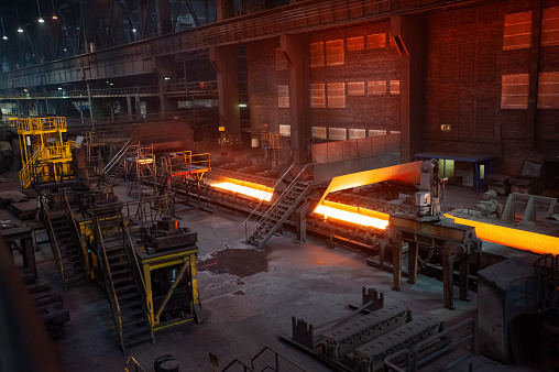 Metallurgical factory in Germany, hot rolled metal conveyor, sheet steel production.