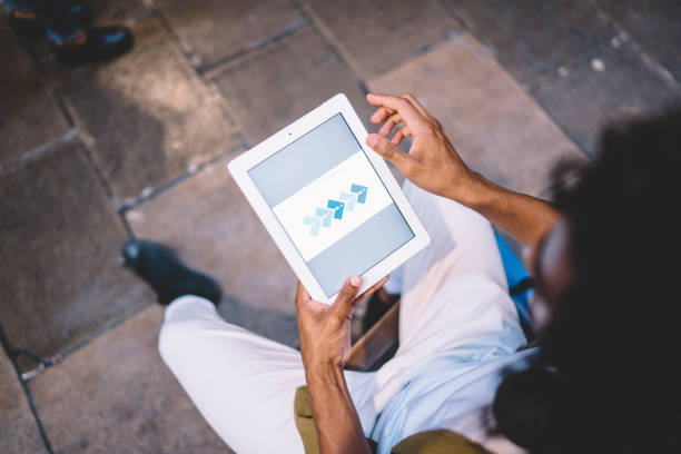 istock Crop man working on tablet on street 1417056888