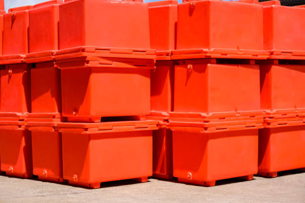 istock Group of orange foldable ice buckets stack on courtyard outside of storage 1417056983