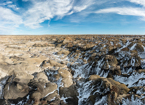 Aerial panoramic view of Bisti De-Na-Zin Wilderness area in New Mexico in winter