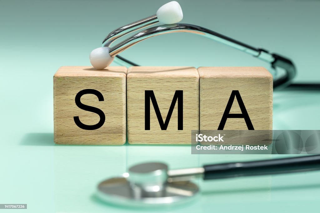 SMA, spinal muscular atrophy, Written on wooden blocks, a rare disease in which, due to a genetic defect, neurons in the spinal cord responsible for muscle contraction and relaxation gradually die. Sports Museum of America Stock Photo