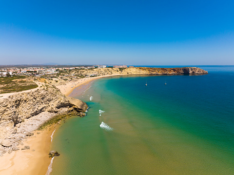 Aerial view, from West, of Mareta Beach, with Sagres village on the top left. Mareta Beach is located  in the southwest Algarve region of southern Portugal.