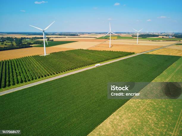 Aerial Drone View Of Wind Turbines And Green And Yellow Fields In Normandy France Stock Photo - Download Image Now