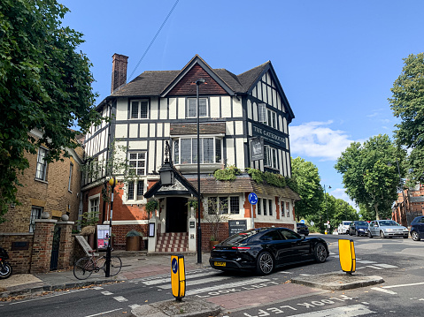 London, England. Street view of Highgate. The Gatehouse is an independent local pub, restaurant and beer garden, located in the picturesque heart of Highgate Village.