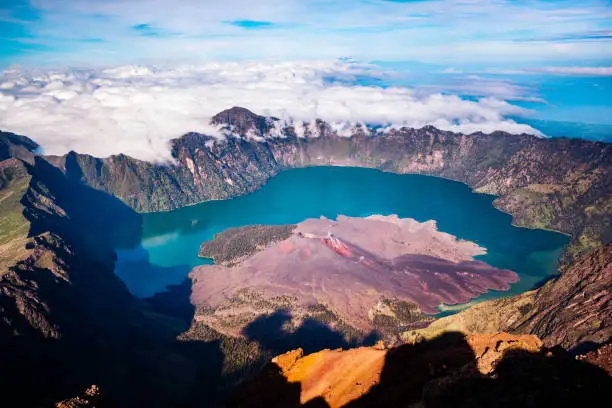 Beautiful view of Lake Segara Anak from the top of Mount Rinjani which is located in Lombok, West Nusa Tenggara, Indonesia. This lake is a volcanic lake formed by the eruption of Mount Rinjani hundreds of years ago.