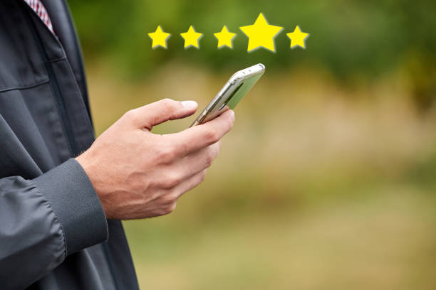 istock Man rates app in smartphone 1417071646