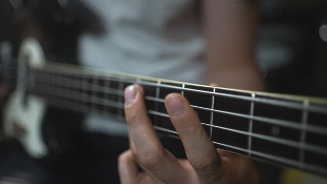 Bassist Practicing Lines In Studio