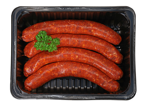 wurstel sausage or Vienna sausages in vacuum pack for sous vide cooking isolated on white with clipping path included.