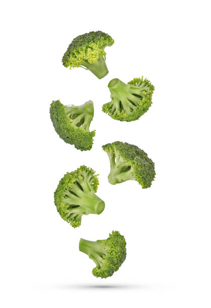 istock Piece of broccoli falling in the air isolated on white 1417075501