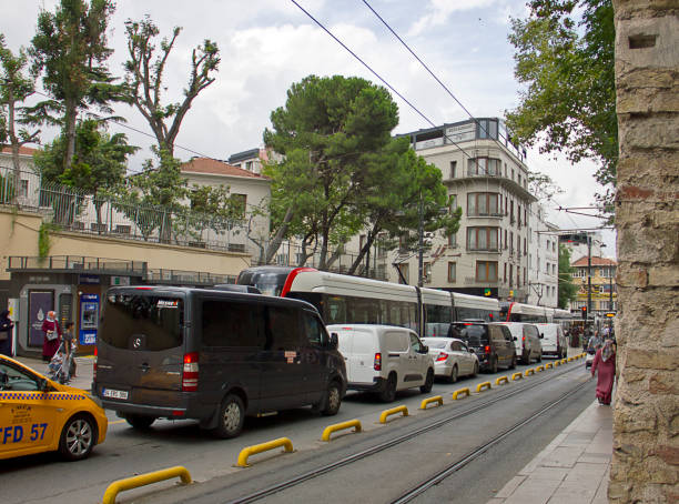 Istanbul,Turkey - August 10, 2022: Street view with people walking at sultanahmet district to gülhane and sirkeci in the Fatih district of Istanbul. There are old colorful houses and mosques during the street. The area contain Hagia sophia mosque, sultanahmet mosque and topkapı palace.