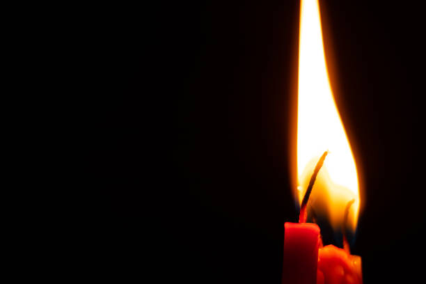 istock candle fire in the dark, burning candle flame 1417077706