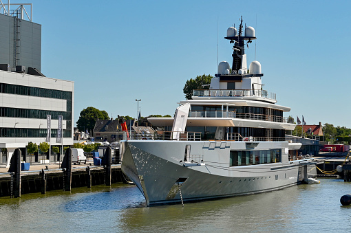 Alblasserdam, Netherlands - August 2022: Brand new luxury super yacht moored outside the Oceanco shipyard. It is reported to have been built for Amazon owner Jeff Bezos.