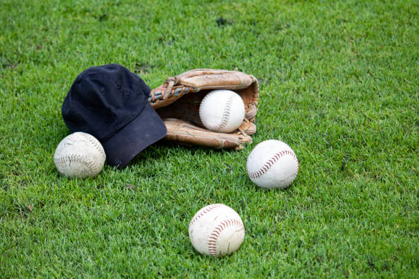 istock Sports equipment lying on a grass field. 1417080781