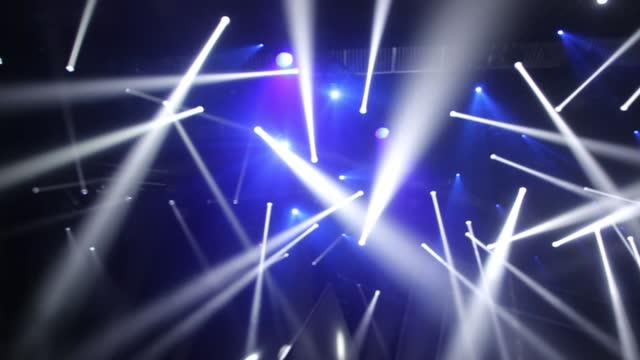 Stage Ray Of Light In Concert Hall. Professional lighting and show effects.