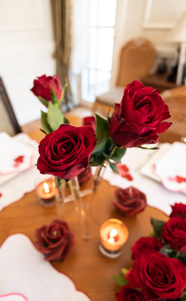 Valentine's themed serving plate and napkin holder, Close-up Video of Dinner Table with Empty Heart and Roses, Slow motion video of empty valentine's table during the Pandemic, dinner table service, serving cutlery and plates at the dinner table