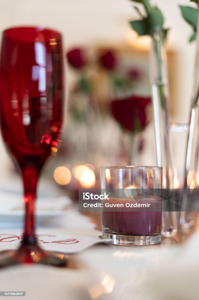 Valentine's themed serving plate and napkin holder, Close-up Video of Dinner Table with Empty Heart and Roses, Slow motion video of empty valentine's table during the Pandemic, dinner table service, serving cutlery and plates at the dinner table Valentine's day themed dinner table in 4k Slow Motion (100 fps) resolution. 2022 Stock Photo