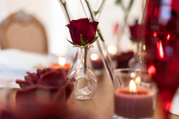 Valentine's themed serving plate and napkin holder, Close-up Video of Dinner Table with Empty Heart and Roses, Slow motion video of empty valentine's table during the Pandemic, dinner table service, serving cutlery and plates at the dinner table