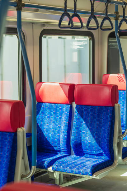 istock Pair of empty seats in public transport car illuminated by sun 1417083973