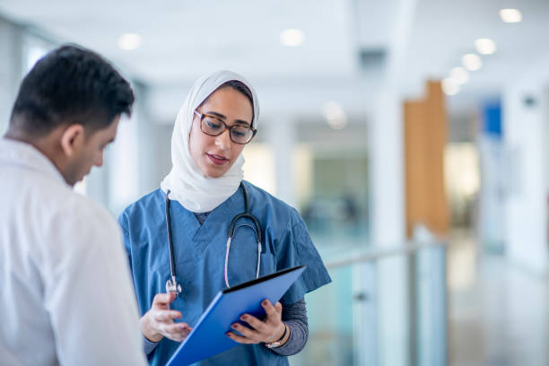istock Doctors Meeting in the Hospital Corridor 1417084898