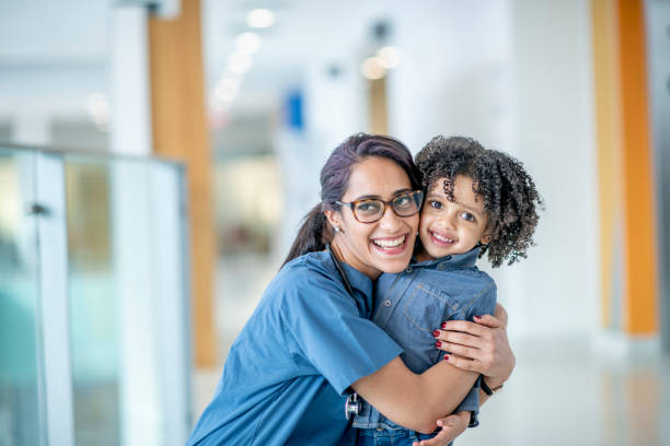 istock Doctor Hugs Little Boy 1417085754