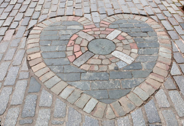 The Heart of Midlothian is a mosaic located outside St Giles' Cathedral in Edinburgh. The heart marks the location of the entrance to Edinburgh's Old Tolbooth which was demolished in 1817. Locals will often spit upon the heart as a sign of good luck. While the tradition is now one of good luck, it was originally believed to be done as a sign of disdain for the executions which took place within the Old Tolbooth