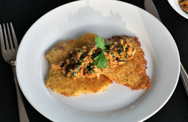 istock Potato pancakes with chanterelle sauce 1417090621