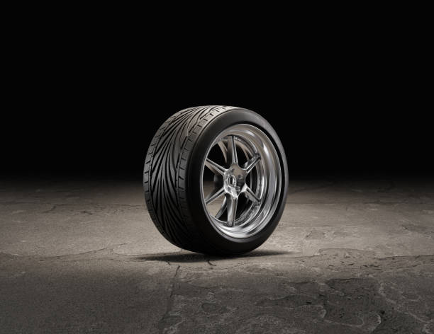 istock Single car wheel on a garage floor. Rubber tire with shiny chrome from side view. 3d rendering 1417093191