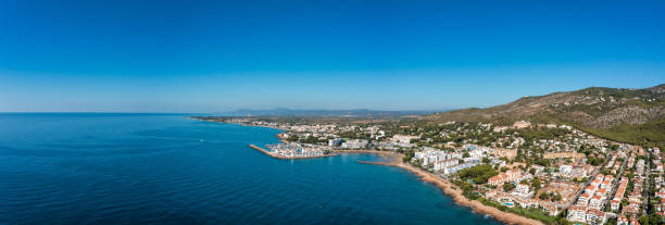 Panoramic view of the beach town of Alcossebre, Spain from the mediterranean sea stock photo