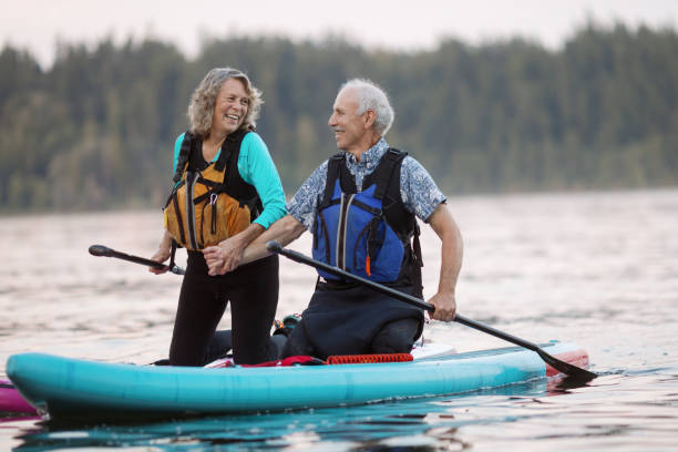 istock Senior Couple Enjoying Paddleboarding in the Pacific Northwest 1417099501