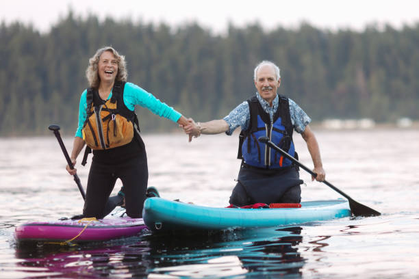 istock Senior Couple Enjoying Paddleboarding in the Pacific Northwest 1417099505